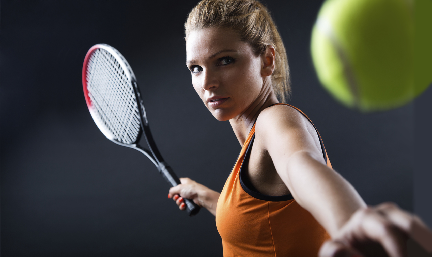 Portrait Of Beautiful Woman Playing Tennis Indoor Isolated On Black • Saw Mill Club